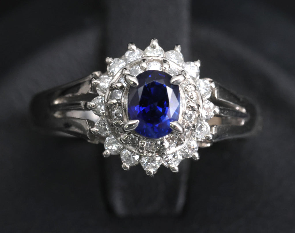 Fine 0.42ct Royal Blue Sapphire & 0.28ct Diamond Halo Platinum Ring, Size 5.5