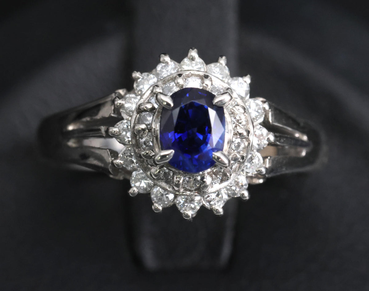 Fine 0.42ct Royal Blue Sapphire & 0.28ct Diamond Halo Platinum Ring, Size 5.5